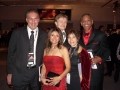 Hedge Fund manager Gregory Antonucci, producer Rick Roberts and media mogul Abe Thompson accompany Neli Vasquez Rowland and entertainment attorney Linda Mensch to the Grammy MusiCares gala.